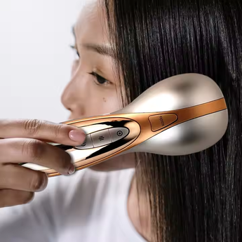 Model using Electric Laser Hair Growth Comb for scalp massage